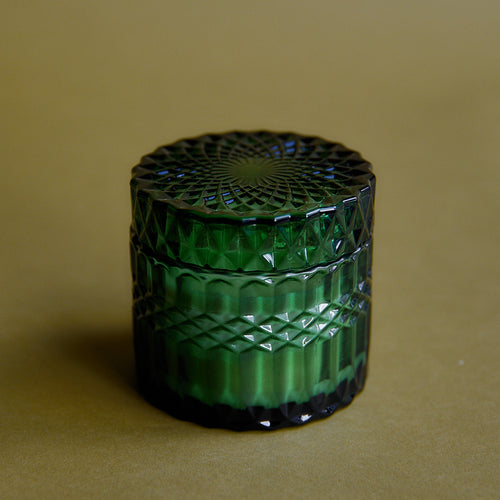 holiday soy candle in green glass jar